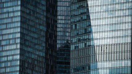 mirrored windows of the facade of an office building