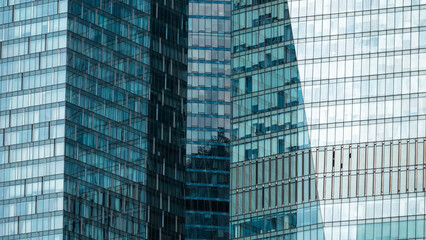 mirrored windows of the facade of an office building
