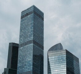 Fototapeta premium mirrored windows of the facade of an office building