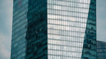 mirrored windows of the facade of an office building