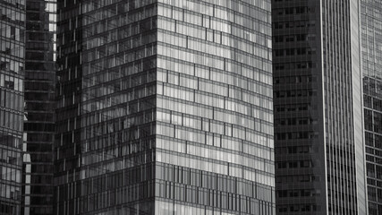 Fototapeta premium mirrored windows of the facade of an office building