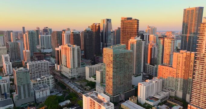 Aerial view of downtown office district of Miami Brickell in Florida, USA. High commercial and residential skyscraper buildings in modern American megapolis at sunset.
