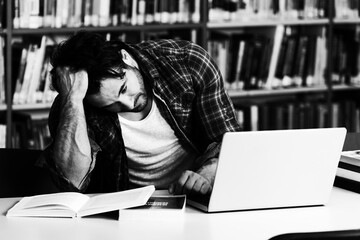 Stressed Student Doing His Homework at the Desk