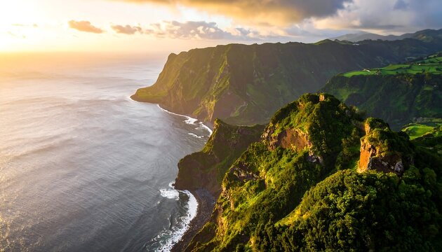 Dramatic coastal landscape at sunset, showcasing rugged cliffs, lush greenery, and a serene ocean vista.