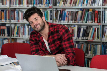 Happy Man Working on Laptop