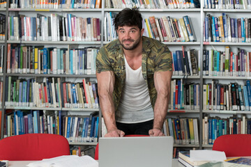 Muscular College Student in a Library