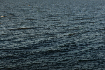 waves on the river filmed on an autumn evening