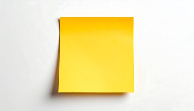 A vibrant yellow sticky note, positioned on a plain white surface, highlights a simple yet effective office aid.