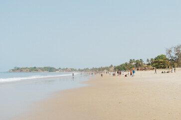 People walking on Lumley Beach Sierra Leone
