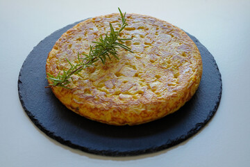 Homemade Spanish omelette (tortilla de patatas)  on white background 