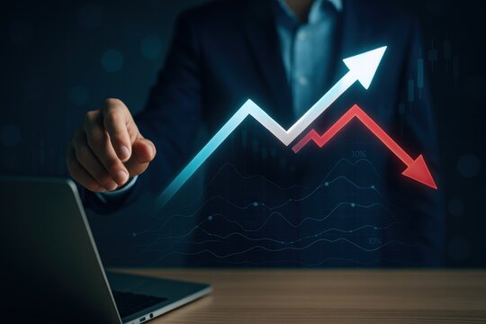 Hand pointing at holographic chart with rising and falling financial arrows for economy analysis 
