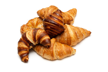 Assortment of various French croissants isolated on a white background