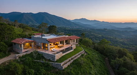 Luxury House on a Hillside With Infinity Pool Overlooking Mountain Valley at Sunset