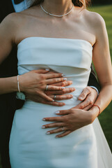 pregnant woman holding her belly