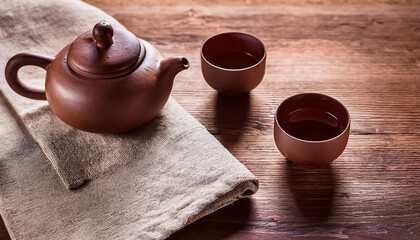 Tea Drinking In Wabi Sabi Japanese Style Features Brown Clay Cups And A Teapot On A Wooden Solid Oak Tea Table Linen Teatowel