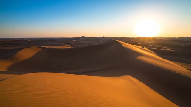 Long shadows gracefully moving across sinuous desert dunes as the sun progresses sand, solitude, exotic