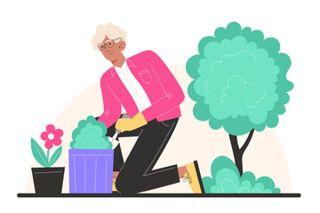 Person gardening planting a shrub in a pot