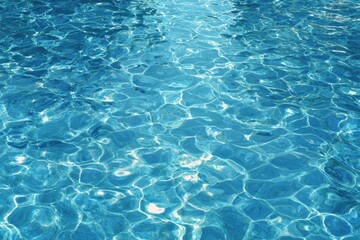 Obraz premium Azure water surface, exhibiting rippled textures and light reflections.