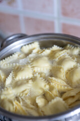 Italian Ravioli Pasta Cooking in a Metal Pot