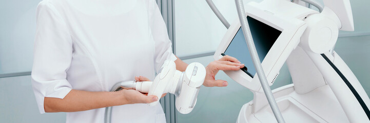 The masseur is preparing to make an hardware lpg massage in a beauty salon