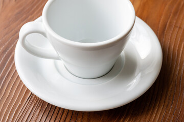 Close-Up of a White Coffee Cup on a Brown Table