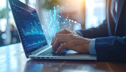Businessman typing on laptop with digital graph overlay. Finance background