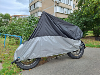 Cover on motorcycle parked near the house © Harmony Video Pro