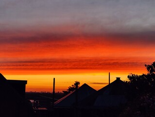 Vibrant Fiery Sunset Over Serene Horizon