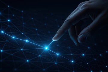 Hand selecting glowing connection point on digital blue network grid 
