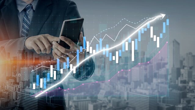 A businessman examines stock market trends using a smartphone, showcasing financial graphs with a modern city backdrop. Ideal for finance and investment themes. Copula - Powered by Adobe
