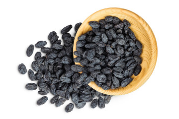 black raisins in wooden bowl isolated on white background. Top view. Flat lay