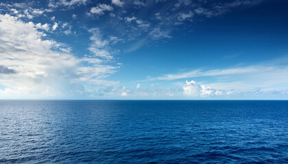 Fototapeta premium Open Sea With Cloudy Blue Sky