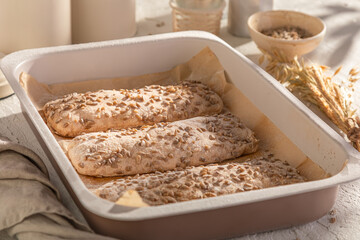Hot sunflower seed buns freshly baked in bakery.