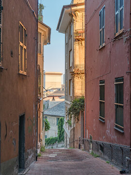 Typical glimpse of narrow alley in the downtown of Genoa, also known as carruggio in local dialect