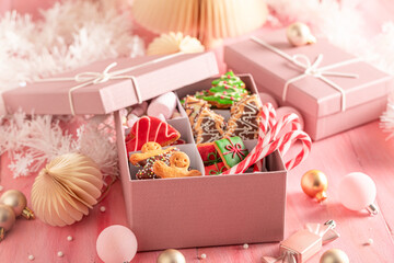Homemade Christmas gingerbread cookies in pink present box..