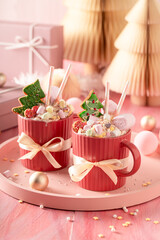 Delicious cocoa with whipped cream and gingerbread in pink.