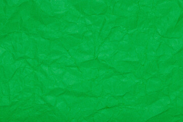 Parakeet green color crumpled paper texture, blank template wrinkly background with space for text