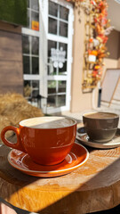 Autumn coffee outdoors in cozy cafe setting