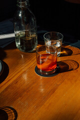 Negroni cocktail on wooden restaurant table