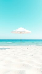 Solitary white beach umbrella offering respite on the tranquil shore under a pastel blue sky