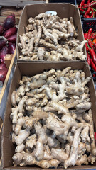 two crates of ginger on the market stall