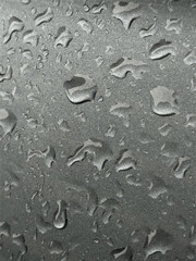 Realistic Water Droplets on Textured Surface Background