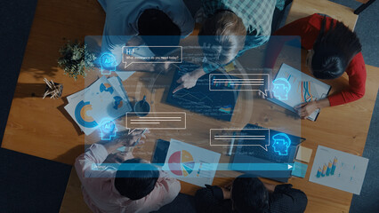 A diverse team collaborates in a modern office setting, utilizing technology for data analysis and communication through digital interfaces and graphical presentations. Trope