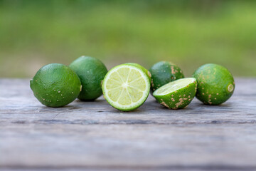Several fresh lemons on a wooden table