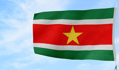 Obraz premium Respectful folded Suriname national flag placed on a surface — suitable for memorial and ceremonial themes.