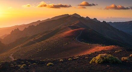 Scenic mountain landscape at sunset with illuminated peaks and dramatic sky