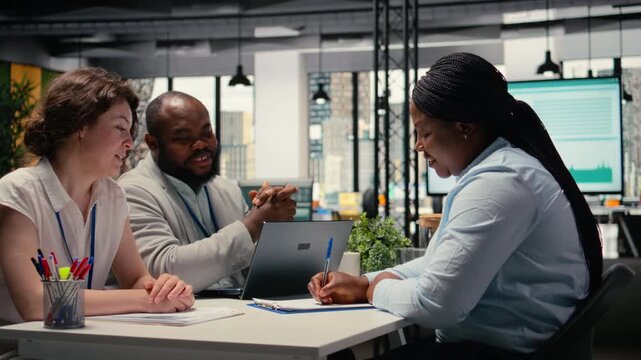 Woman applicant signing employment agreement after job interview, completing the recruitment process and beginning a new chapter in a famous corporation. Legal contract terms. Camera A.
