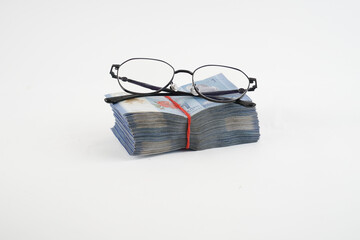 stack money and glasses
