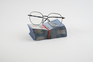 glasses and money