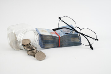money ringgit and a stack of coins